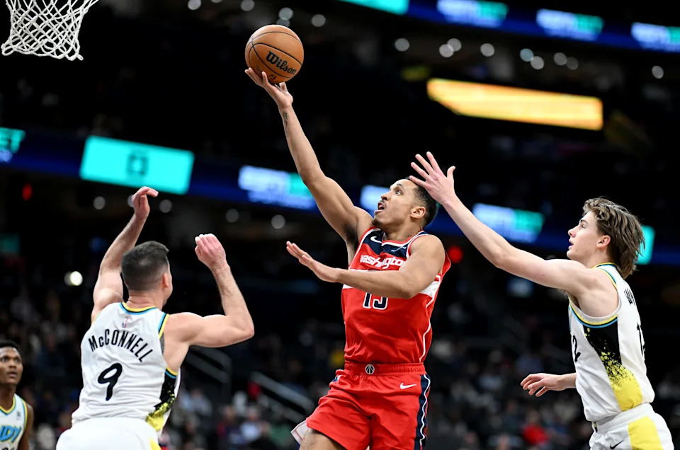 WASHINGTON, DC - FEBRUARY 12: Malcolm Brogdon #15 of the Washington Wizards drives to the basket against Johnny Furphy #12 of the Indiana Pacers at Capital One Arena on February 12, 2025 in Washington, DC. NOTE TO USER: User expressly acknowledges and agrees that, by downloading and or using this photograph, User is consenting to the terms and conditions of the Getty Images License Agreement. (Photo by G Fiume/Getty Images)