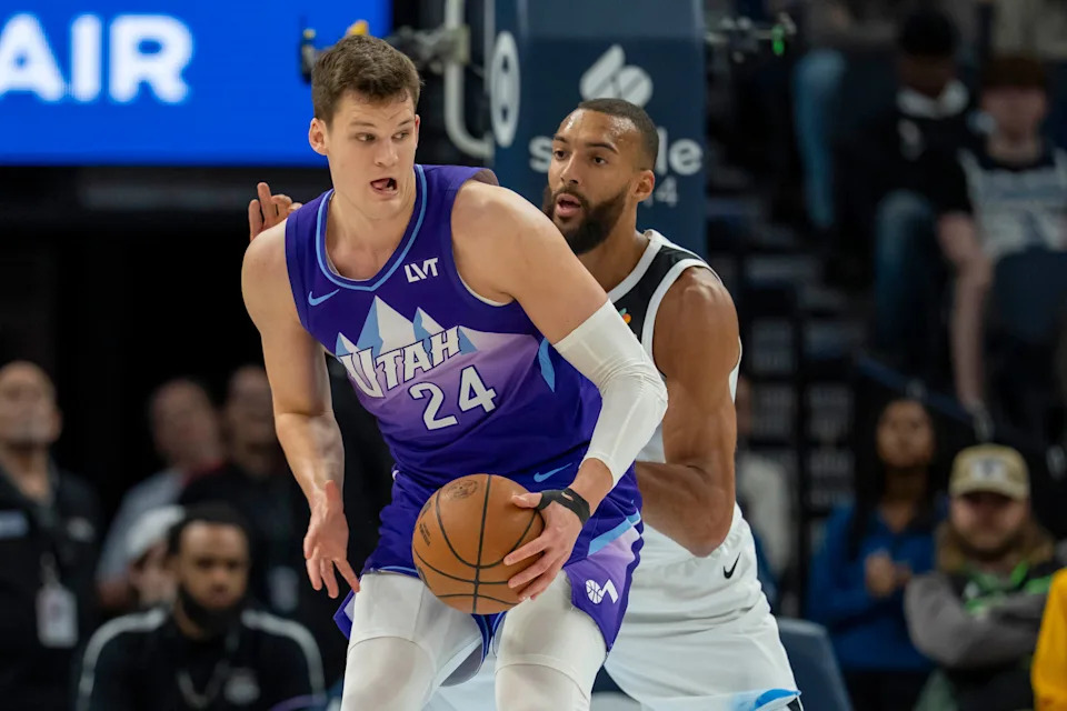Mar 16, 2025; Minneapolis, Minnesota, USA; Utah Jazz center Walker Kessler (24) backs towards the basket as Minnesota Timberwolves center Rudy Gobert (27) plays defense in the first half at Target Center. Mandatory Credit: Jesse Johnson-Imagn Images