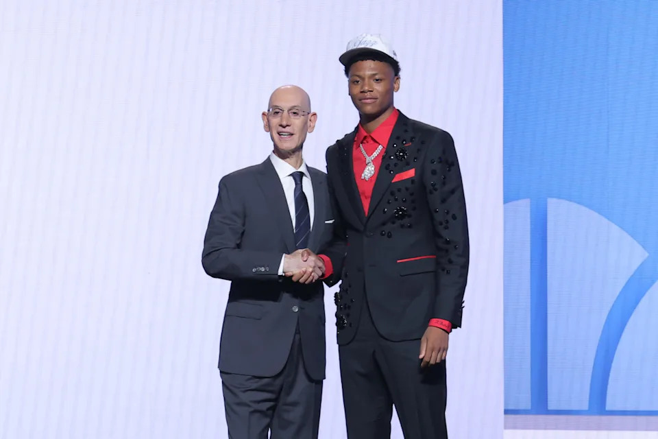 Ace Bailey stands with NBA commissioner Adam SilverBrad Penner-Imagn Images