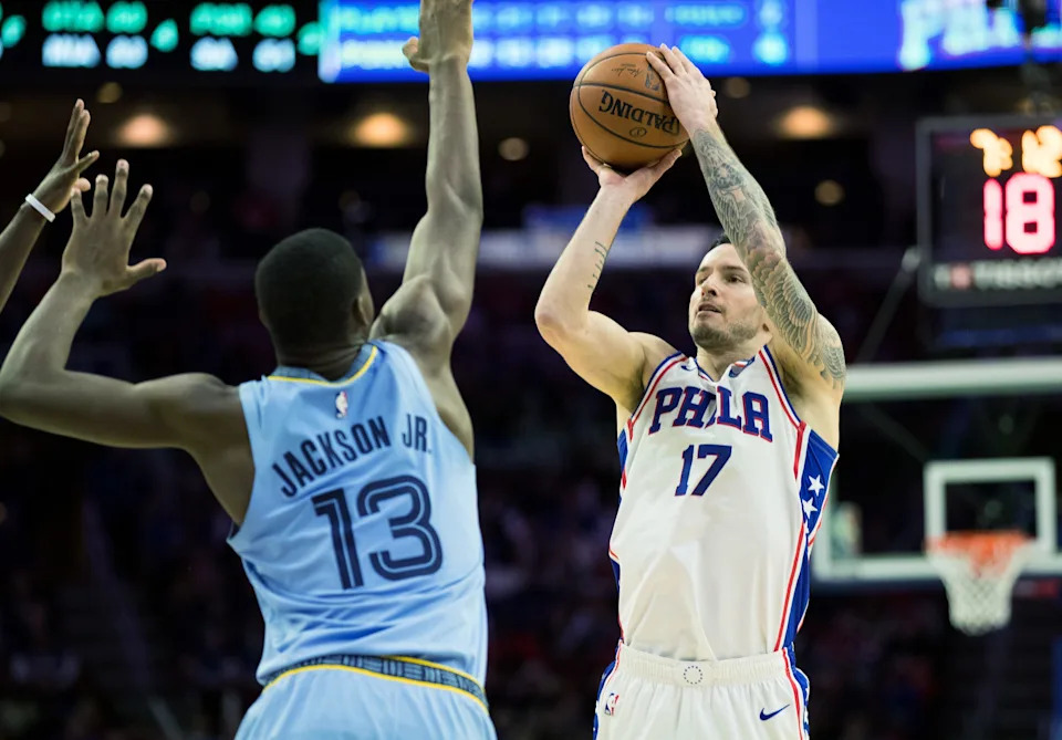 Dec 2, 2018; Philadelphia, PA, USA; Philadelphia 76ers guard JJ Redick (17) shoots as Memphis Grizzlies forward Jaren Jackson Jr. (13) defends during the fourth quarter at Wells Fargo Center. Mandatory Credit: Bill Streicher-USA TODAY Sports