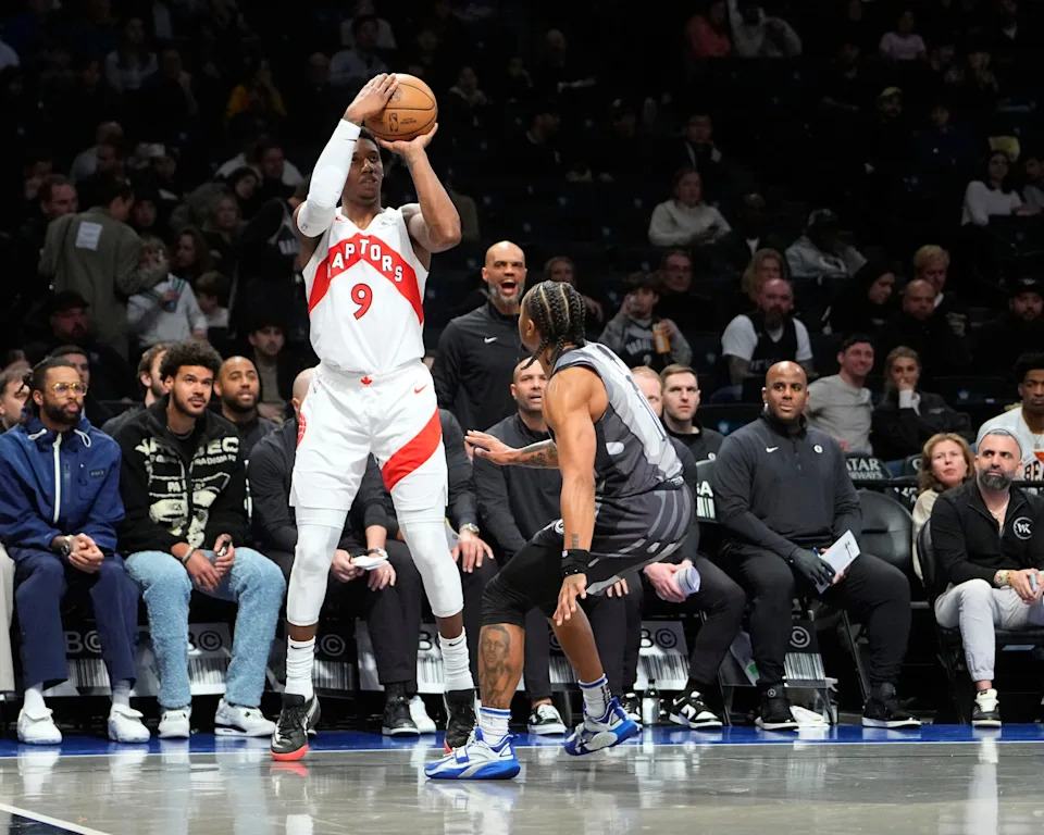Apr 6, 2025; Brooklyn, New York, USA; Toronto Raptors shooting guard RJ Barrett (9) shoots a three point jump shot over Brooklyn Nets guard Tyson Eitenne (10) during the first half at Barclays Center. Mandatory Credit: Gregory Fisher-Imagn Images