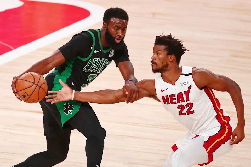 Sep 17, 2020; Lake Buena Vista, Florida, USA; Miami Heat forward Jimmy Butler (22) defends Boston Celtics guard Jaylen Brown (7) during the fourth quarter in game two of the Eastern Conference Finals of the 2020 NBA Playoffs at ESPN Wide World of Sports Complex. Mandatory Credit: Kim Klement-USA TODAY Sports