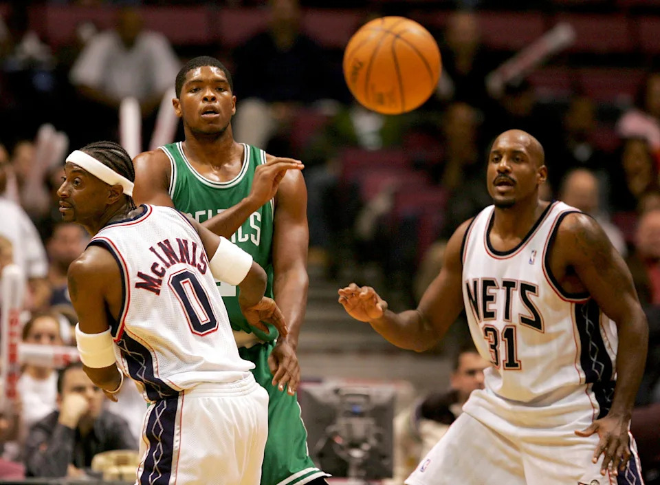EAST RUTHERFORD, NJ - OCTOBER 25: Jeff McInnis #0 and Lamond Murray #31 of the New Jersey Nets guard Ryan Gomes #4 of the Boston Celtics as he passes the ball at Continental Airlines Arena on October 25, 2005 in East Rutherford, New Jersey. NOTE TO USER: User expressly acknowledges and agrees that, by downloading and or using this Photograph, user is consenting to the terms and conditions of the Getty Images License Agreement. (Photo by Ezra Shaw/Getty Images)