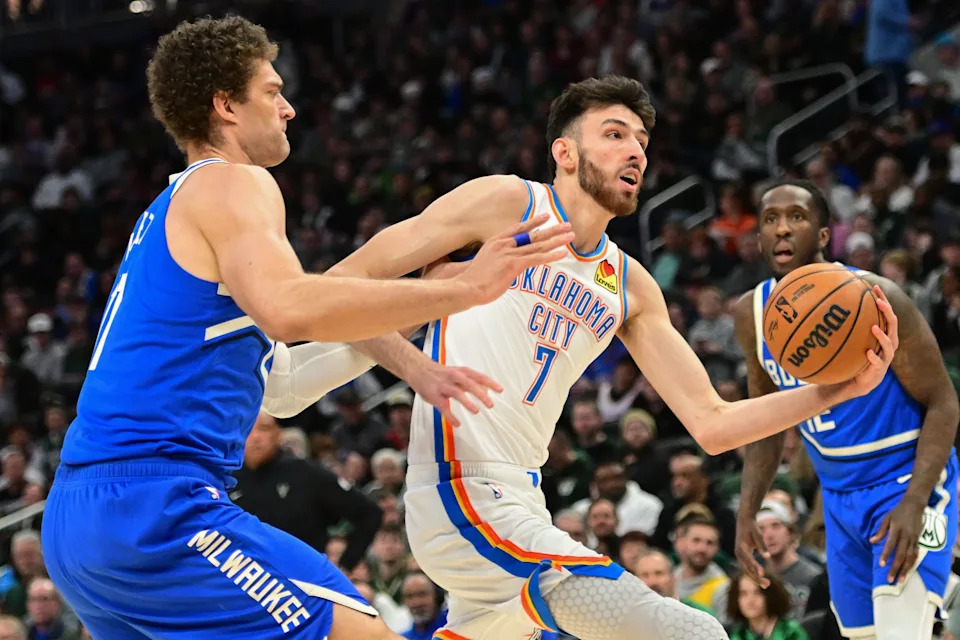 Mar 16, 2025; Milwaukee, Wisconsin, USA; Oklahoma City Thunder center Chet Holmgren (7) takes a shot against Milwaukee Bucks center Brook Lopez (11) in the first quarter at Fiserv Forum. Mandatory Credit: Benny Sieu-Imagn Images