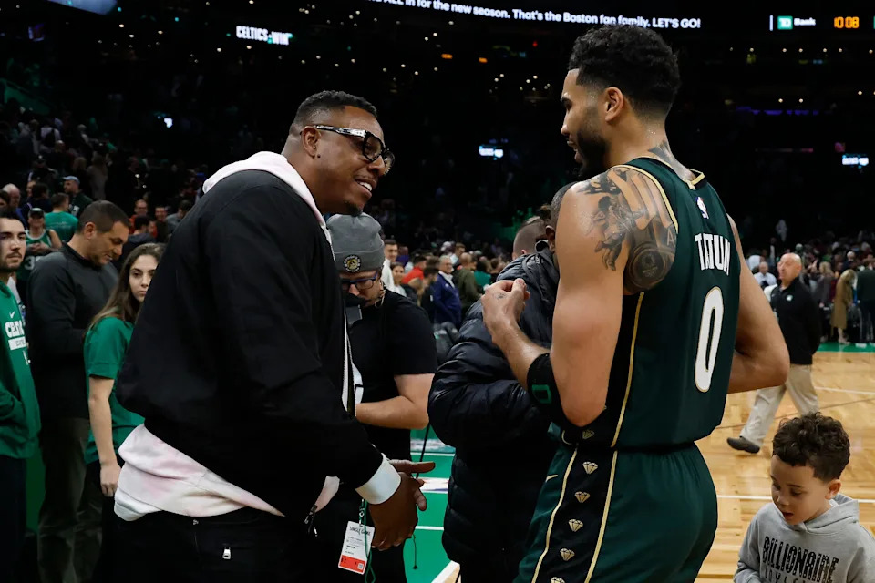 Oct 18, 2022; Boston, Massachusetts, USA; Boston Celtics forward Jayson Tatum (0) talks with former Celtics great Paul Pierce after they defeated the Philadelphia 76ers at TD Garden. Mandatory Credit: Winslow Townson-USA TODAY Sports