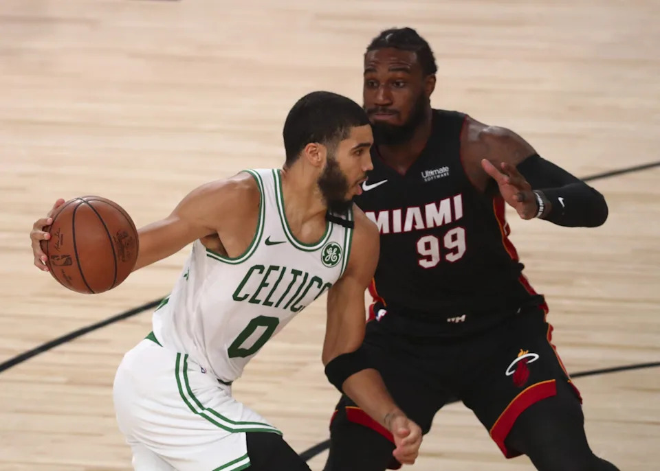 Sep 27, 2020; Lake Buena Vista, Florida, USA; Boston Celtics forward Jayson Tatum (0) looks to drive the ball defended by Miami Heat forward Jae Crowder (99) during second half in game six of the Eastern Conference Finals of the 2020 NBA Playoffs at AdventHealth Arena. Mandatory Credit: Kim Klement-USA TODAY Sports