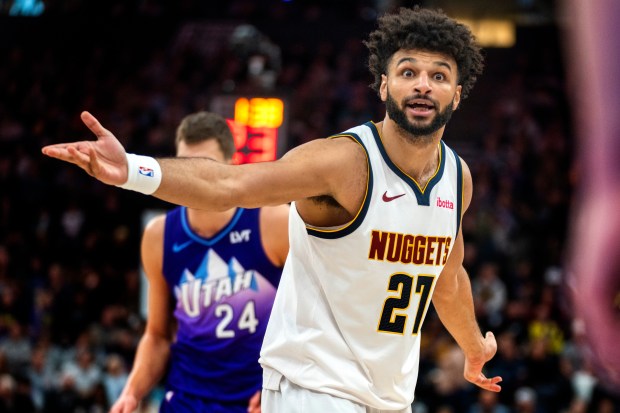 Denver Nuggets guard Jamal Murray (27) reacts to a call by an official, during the second half of an NBA basketball game against the Utah Jazz, Monday, Dec. 30, 2024, in Salt Lake City. (AP Photo/Rick Egan)