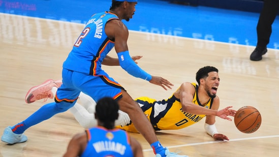 Indiana Pacers guard Tyrese Haliburton (0) falls to the court with an injury during the first half of Game 7 of the NBA Finals basketball series against the Oklahoma City Thunder Sunday.(AP)