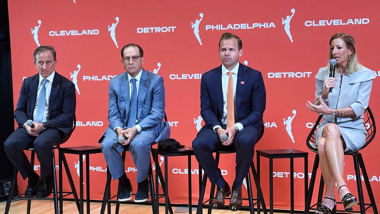 Josh Harris, left, managing partner of the Philadelphia 76ers, Arn Tellem, Detroit Pistons vice chairman, Nic Barlage, representing the Cleveland Cavaliers, listen as WNBA commissioner Cathy Engelbert speaks during a news conference, Monday, June 30, 2025, in New York, announcing WNBA basketball expansion teams in Philadelphia, Detroit and Cleveland.