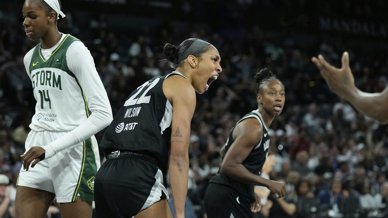 Las Vegas Aces center A'ja Wilson (22) celebrates after a play against the Seattle Storm during the second half of Game 3 in the first round of the WNBA basketball playoffs Thursday, Sept. 18, 2025, in Las Vegas. (AP Photo/John Locher)
