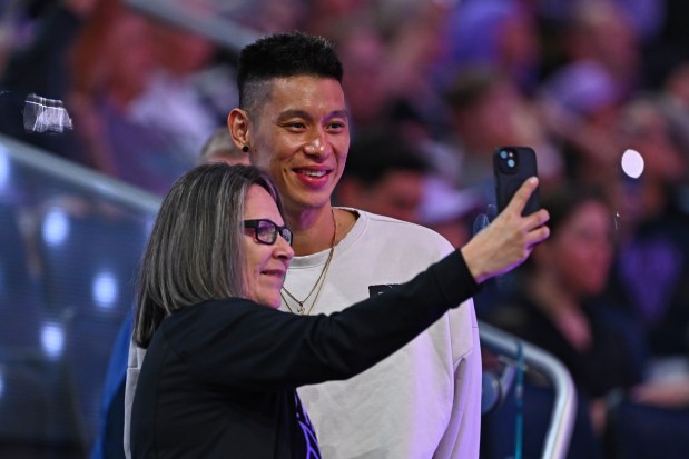 Former NBA player Jeremy Lin stops to pose for a selfie with a fan during the WNBA game at Chase Center in San Francisco, Calif., on Saturday, Aug. 30, 2025. The Golden State Valkyries defeated the Washington Mystics 99-62. (Jose Carlos Fajardo/Bay Area News Group)