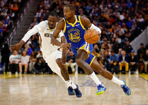 Golden State Warriors' Jonathan Kuminga (00) dribbles against New Orleans Pelicans' Javonte Green (4) in the third quarter at the Chase Center in San Francisco, Calif., on Wednesday, Oct. 30, 2024. (Nhat V. Meyer/Bay Area News Group)