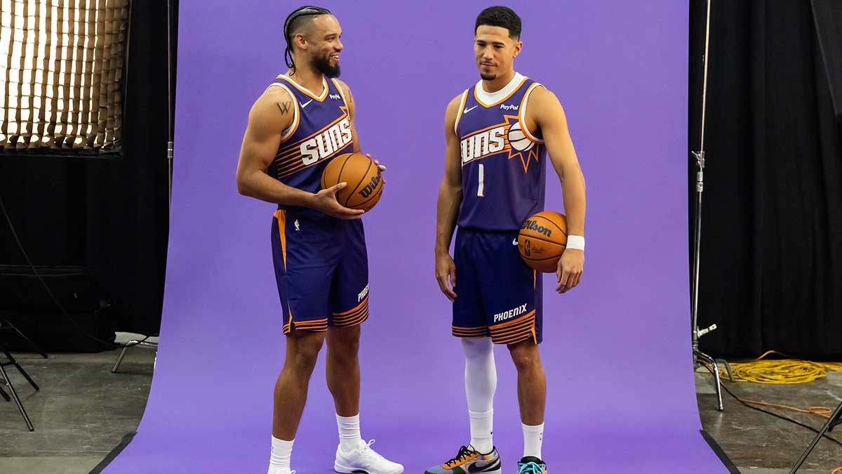 Phoenix Suns forward Dillon Brooks (3) and guard Devin Booker (1) pose for portrait during Media Day at PHX Arena.