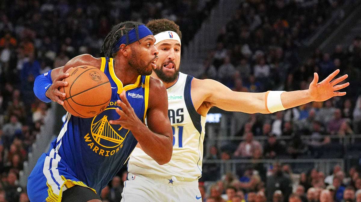 Golden State Warriors guard Buddy Hield (left) drives against Dallas Mavericks guard Klay Thompson (right) during the fourth quarter at Chase Center.