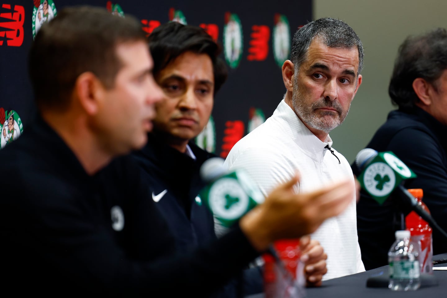Bill Chisholm, the new lead owner and governor of the Celtics, listens to president of basketball operations Brad Stevens at Thursday's news conference.