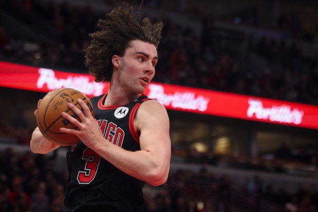 Bulls guard Josh Giddey grabs a rebound against the Heat on April 9, 2025, at the United Center. (Audrey Richardson/Chicago Tribune)