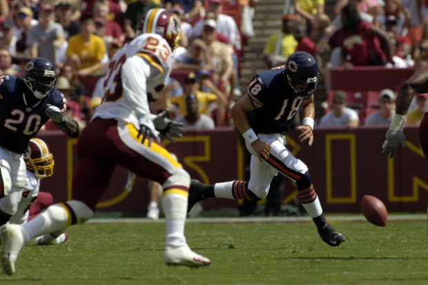 Chicago Bears quarterback Kyle Orton fumbles the ball but managed to recover it as Washington Redskins safety Omar Stoutmire closes on Sept. 11, 2005 at FedEx Field in Maryland. The Bears lost 9-7. (Pete Souza/Chicago Tribune)