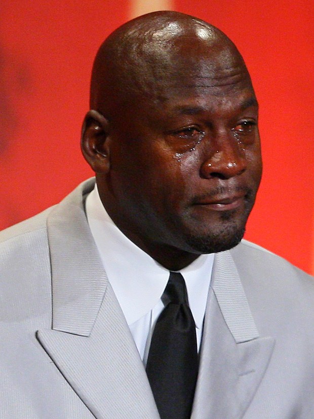 Former Chicago Bulls and Washington Wizards guard Michael Jordan cries as he takes the podium during his enshrinement ceremony into the Naismith Basketball Hall of Fame in Springfield, Mass., on Sept. 11, 2009. (Stephan Savoia/AP)
