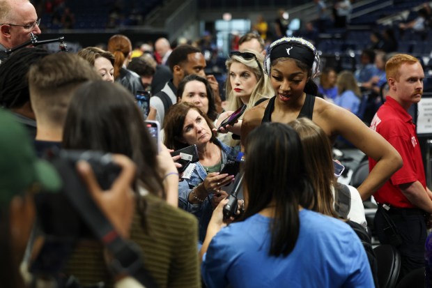 Chicago Sky forward Angel Reese answers questions before the game...