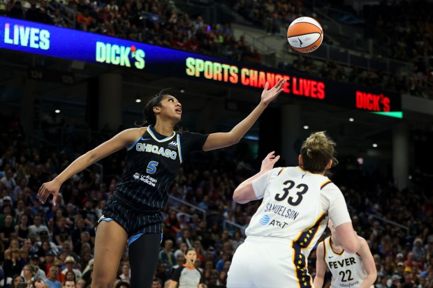 Chicago Sky forward Angel Reese (5) reaches for a loose...