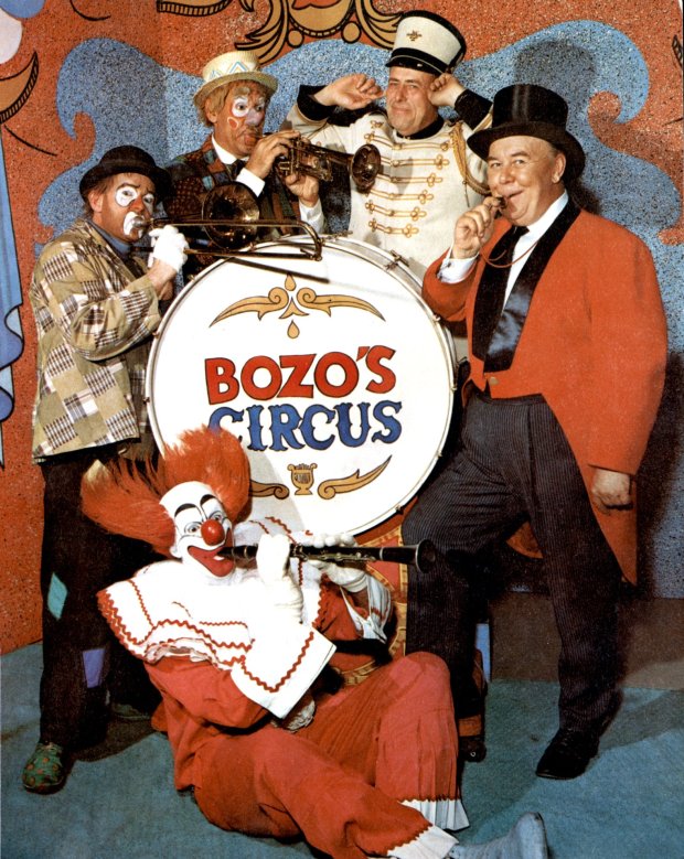 Original cast members of "Bozo's Circus," which premiered in 1961, include (standing, left to right )Don Sandburg as Sandy the Clown; Ray Rayner as Oliver O'Oliver; Maestro Bob Trendler; Ned Locke as the Ringmaster, and Bob Bell as Bozo (seated in front). (Chicago Tribune archive)