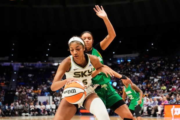 Brazil forward Manu Alves defends Sky forward Angel Reese in...