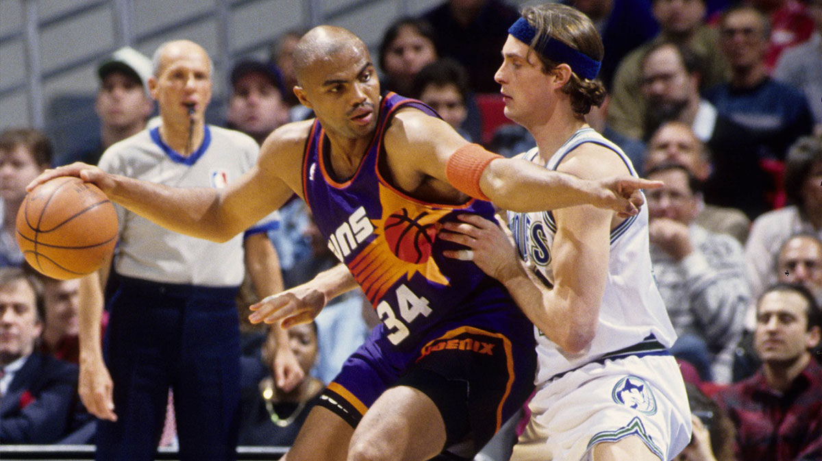 Phoenix Suns forward Charles Barkley (34) is defended by Minnesota Timberwolves forward Christian Laettner (32) at the Target Center.
