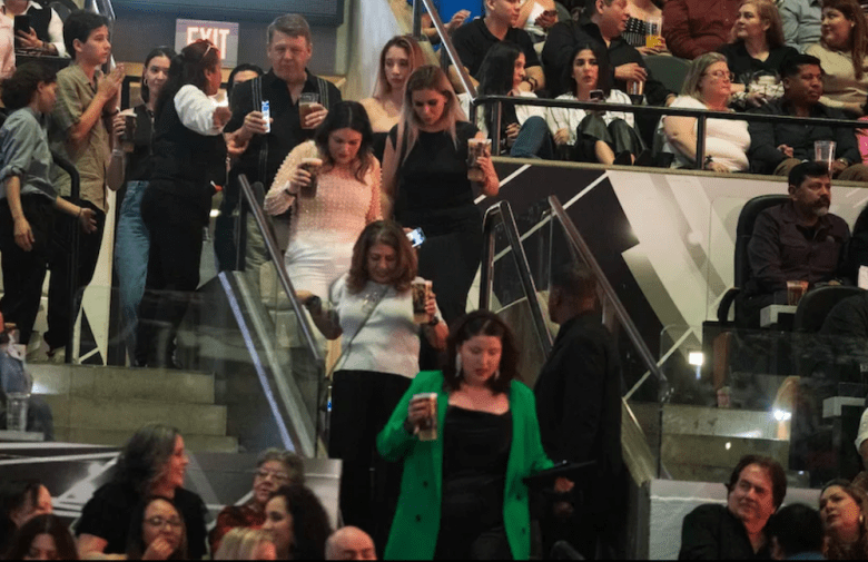 Fans file to their seats during a Spurs game.