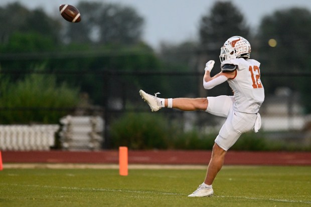 Mead’s Eli Davis punts against Frederick on Friday, Sept. 5,...