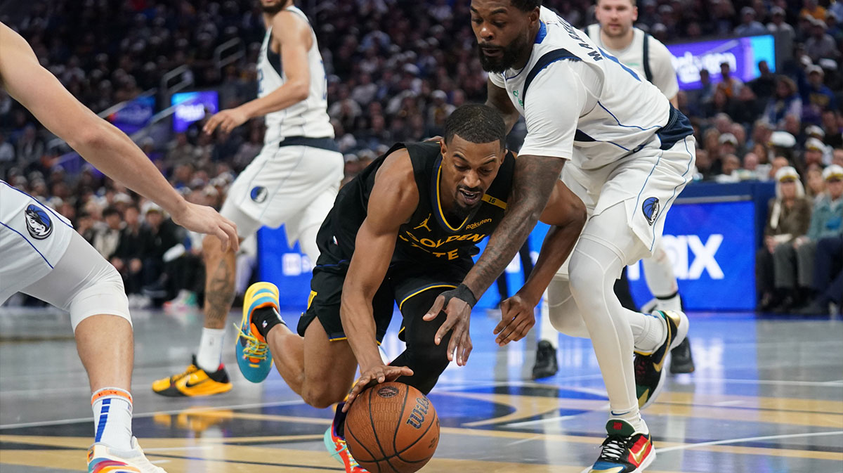 Golden State Warriors guard De'Anthony Melton (8) loses control of the ball next to Dallas Mavericks forward Naji Marshall (13) in the fourth quarter at the Chase Center.