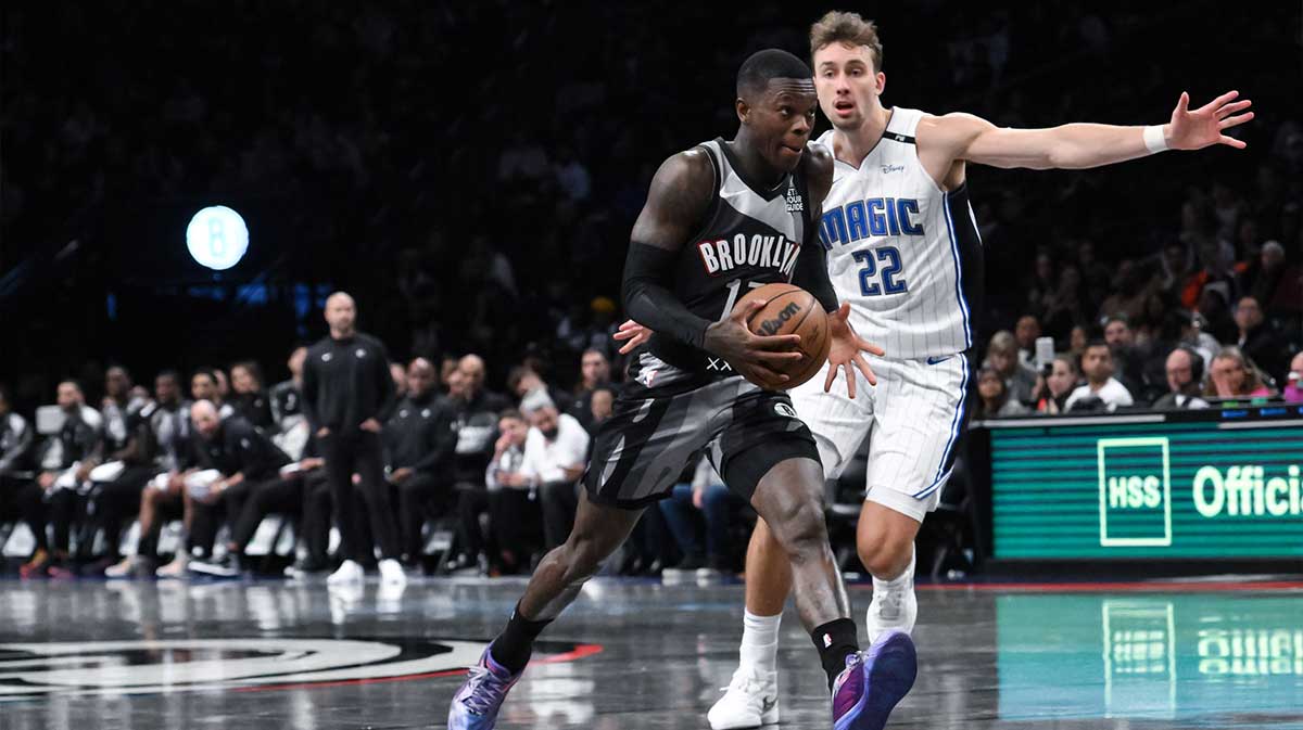 Brooklyn Nets guard Dennis Schroder (17) drives to the basket while being defended by Orlando Magic forward Franz Wagner (22) during the second half at Barclays Center.