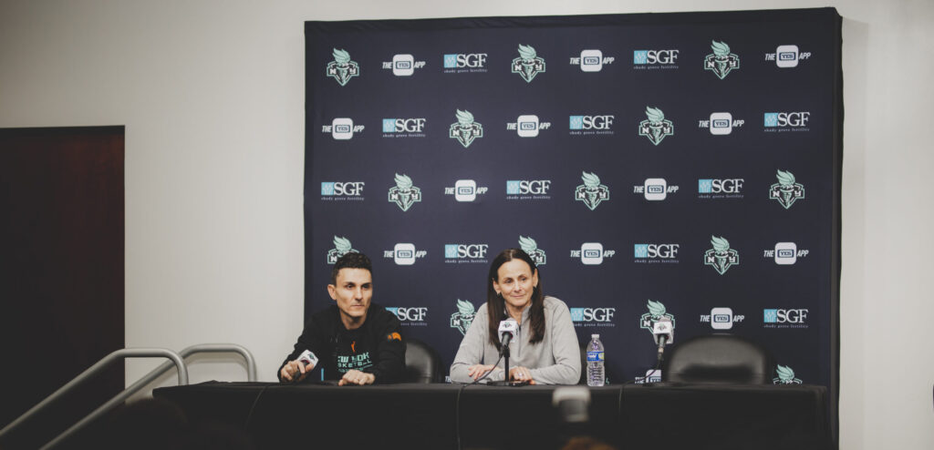 Sandy Brondello and Jonathan Kolb sit in the New York Liberty press room prior to the 2023 season. 