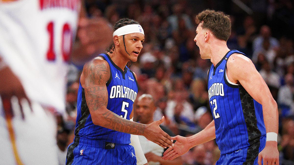 Orlando Magic forward Paolo Banchero (5) and forward Franz Wagner (22) celebrate after a basket against the Golden State Warriors in the second quarter at Kia Center.