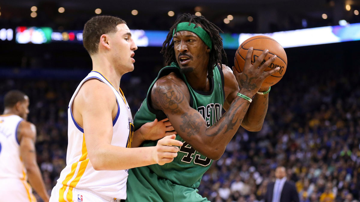 Boston Celtics small forward Gerald Wallace (45) controls the ball against Golden State Warriors shooting guard Klay Thompson (11) during the second quarter at Oracle Arena.