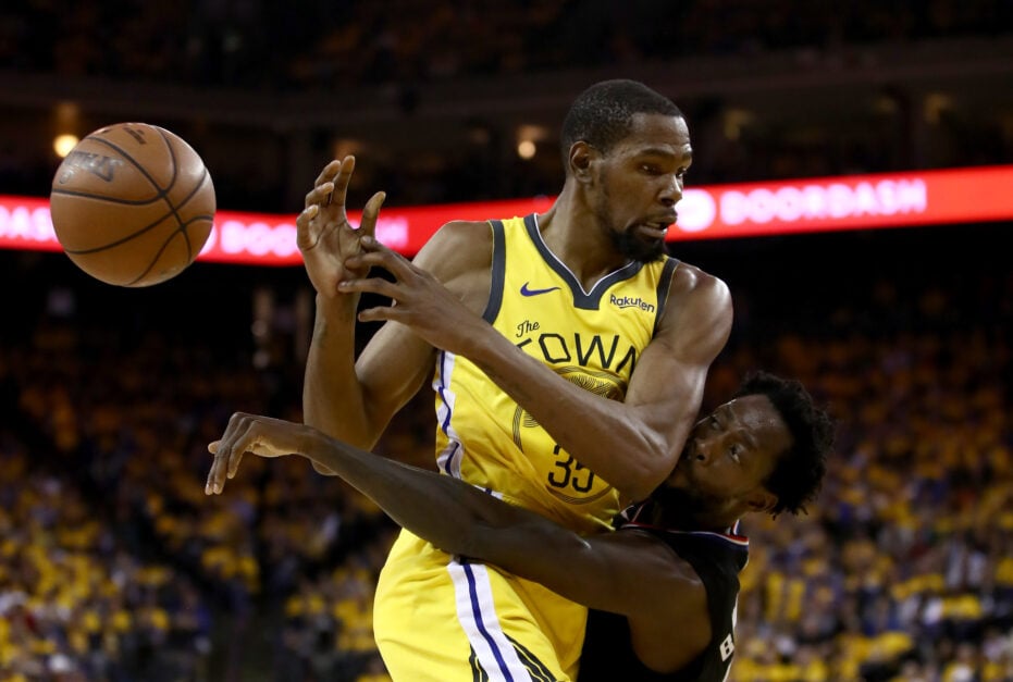 Kevin Durant #35 of the Golden State Warriors is guarded by Patrick Beverley #21 of the LA Clippers during Game Two of the first round of the 2019 NBA Western Conference Playoffs at ORACLE Arena on April 15, 2019 in Oakland, California.