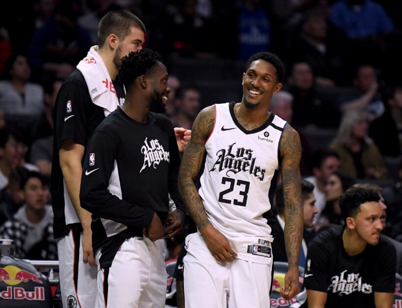 Lou Williams #23 of the LA Clippers laughs with Patrick Beverley #21 during a 122-95 Clipper win over the Orlando Magic at Staples Center.