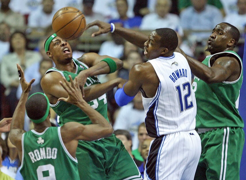 Boston Celtics guard Rajon Rondo, forward Paul Pierce, Orlando Magic center Dwight Howard and Boston Celtics center Kendrick Perkins rebound in the first quarter of Game 6 of the Eastern Conference semifinals during the NBA Playoffs at the Amway Arena.