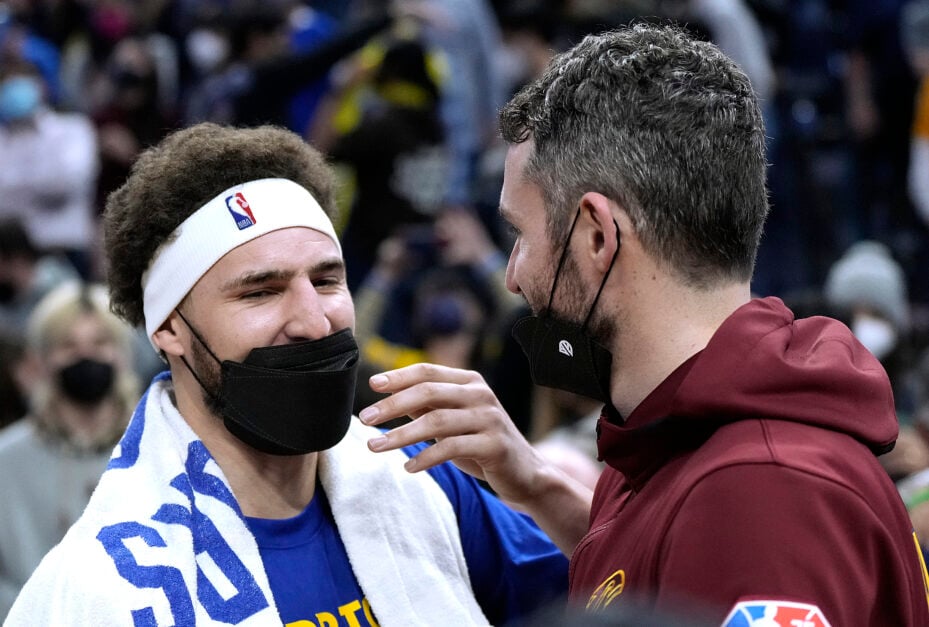 Klay Thompson #11 of the Golden State Warriors talks with Kevin Love #0 of the Cleveland Cavaliers after their game at Chase Center.