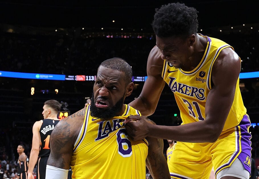LeBron James #6 of the Los Angeles Lakers reacts with Thomas Bryant #31 after drawing a foul on a basket against the Atlanta Hawks during the fourth quarter at State Farm Arena.