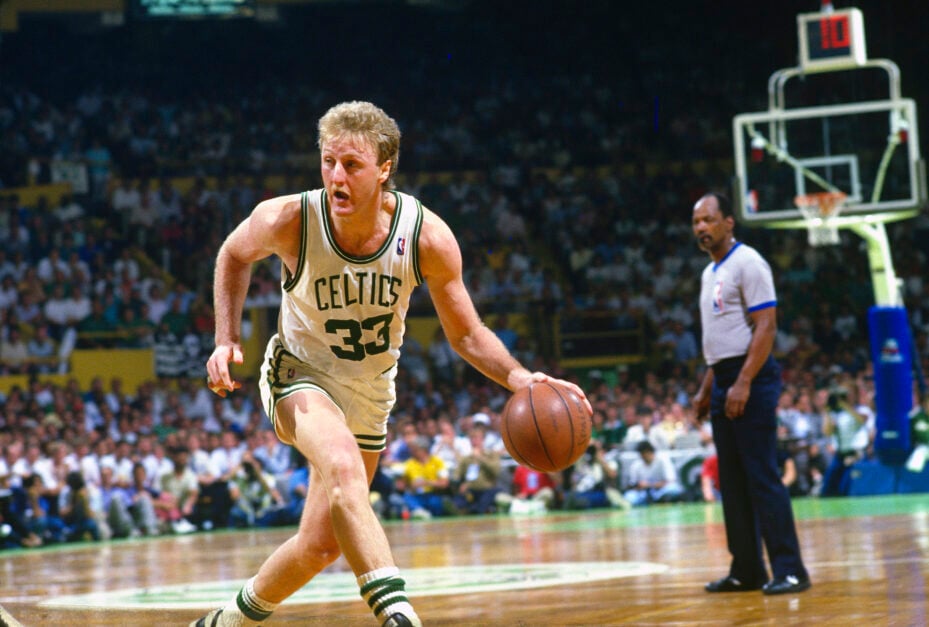 Larry Bird #33 of the Boston Celtics dribbles the ball against the Los Angeles Lakers during the NBA Finals June 1987 at The Boston Garden.