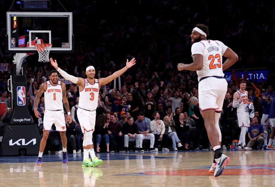 Obi Toppin #1,Josh Hart #3 and Mitchell Robinson #23 of the New York Knicks celebrate