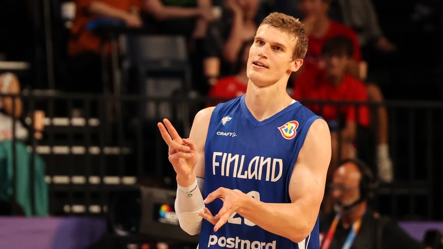 Lauri Markkanen #23 of Finland celebrates