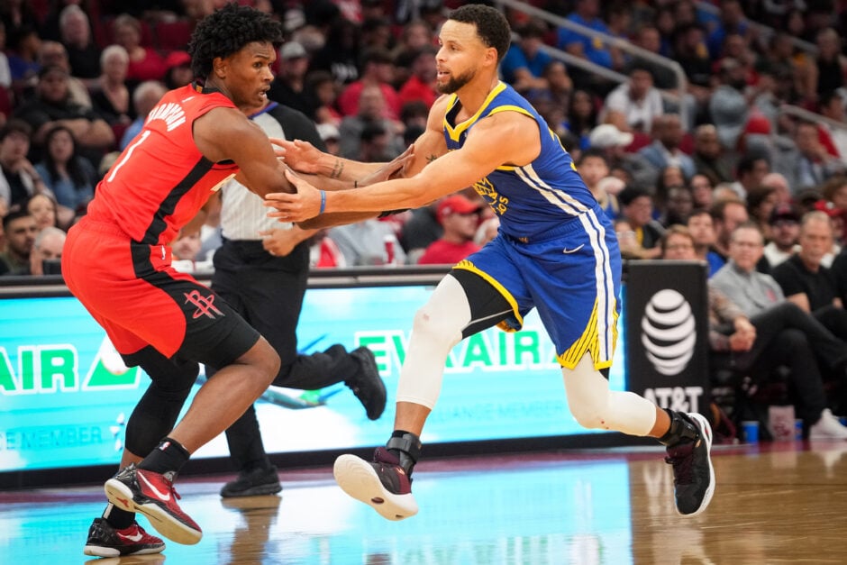 Houston Rockets guard Amen Thompson (1) guards Golden State Warriors guard Stephen Curry (30) during the first quarter of an NBA game.