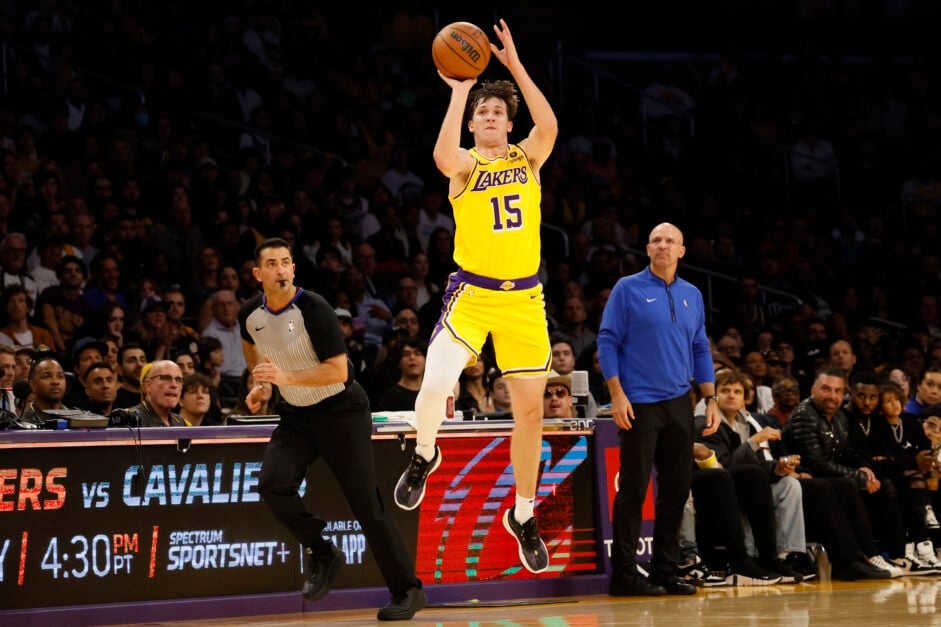Los Angeles Lakers guard Austin Reaves (15) launches a last second half court shot, but is a tick too late to beat the buzzer against the Dallas Mavericks.