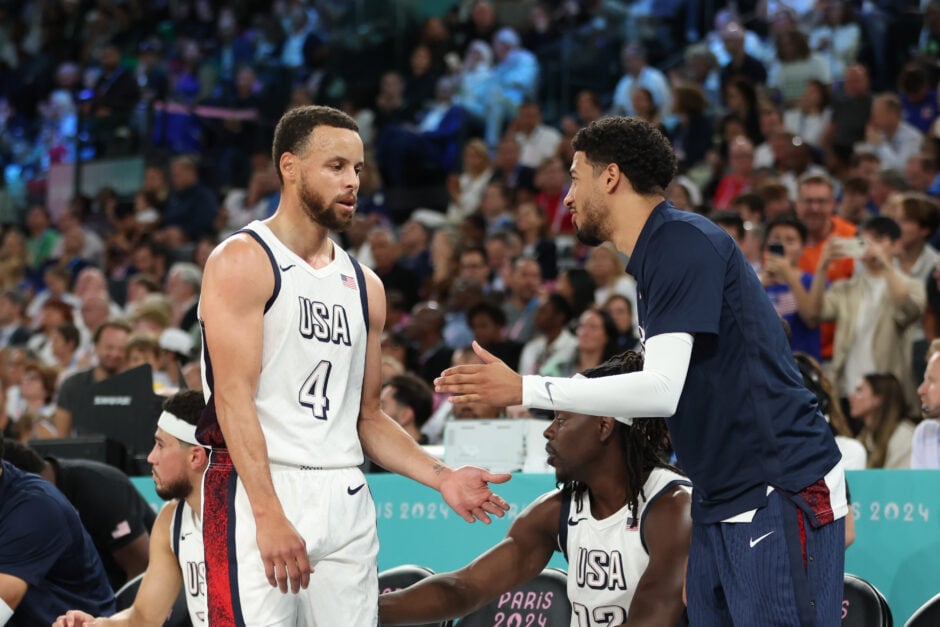Stephen Curry #4 and Tyrese Haliburton #9 of Team United States high five during a Men's basketball semifinals match between Team United States and Team Serbia on day thirteen of the Olympic Games Paris 2024 at Bercy Arena.