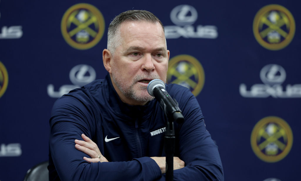 DENVER, COLORADO - SEPTEMBER 26: Head coach Michael Malone of the Denver Nuggets fields questions d...