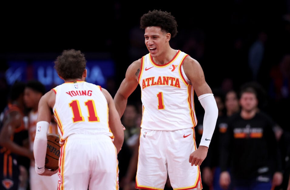 Trae Young #11 of the Atlanta Hawks celebrates the win with teammate Jalen Johnson