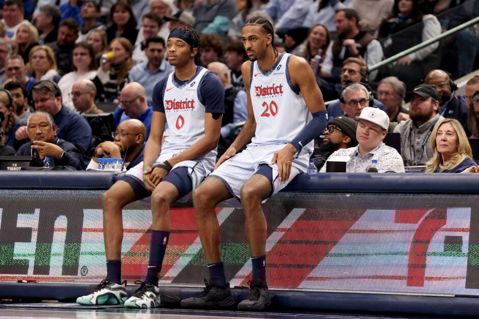 Bilal Coulibaly #0 of the Washington Wizards and Alex Sarr #20 of the Washington Wizards wait to come into the game against the Dallas Mavericks during the second quarter at American Airlines Center.