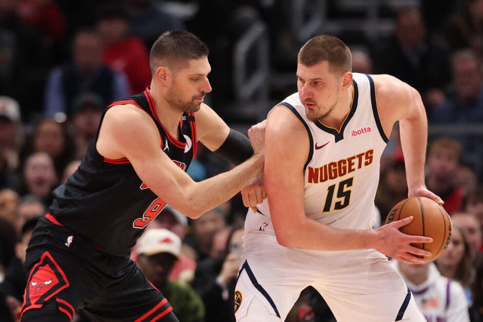 Nikola Jokic #15 of the Denver Nuggets is defended by Nikola Vucevic #9 of the Chicago Bulls during the second half at the United Center.