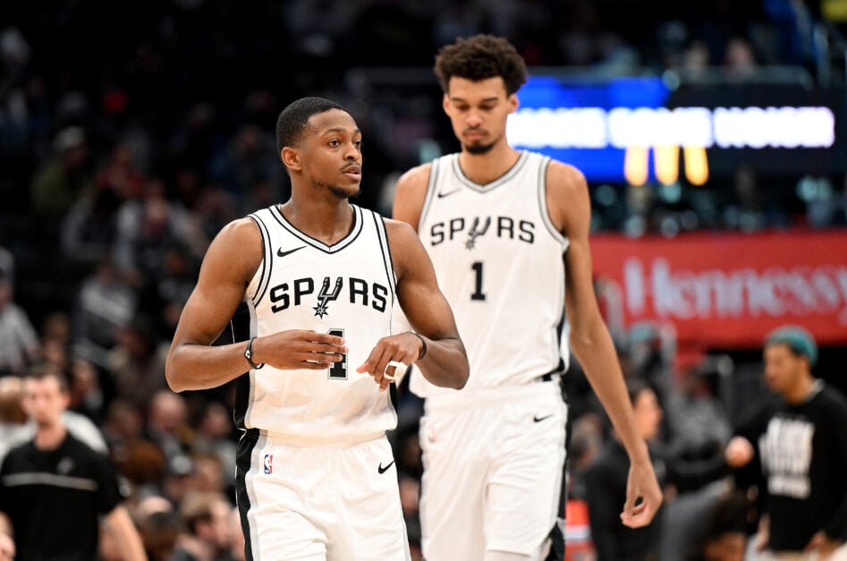 De'Aaron Fox #4 and Victor Wembanyama #1 of the San Antonio Spurs walk down the court during the game against the Washington Wizards at Capital One Arena.